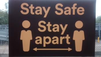 stay safe stay apart road sign