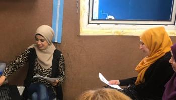 3 Arab women sitting in a classroom